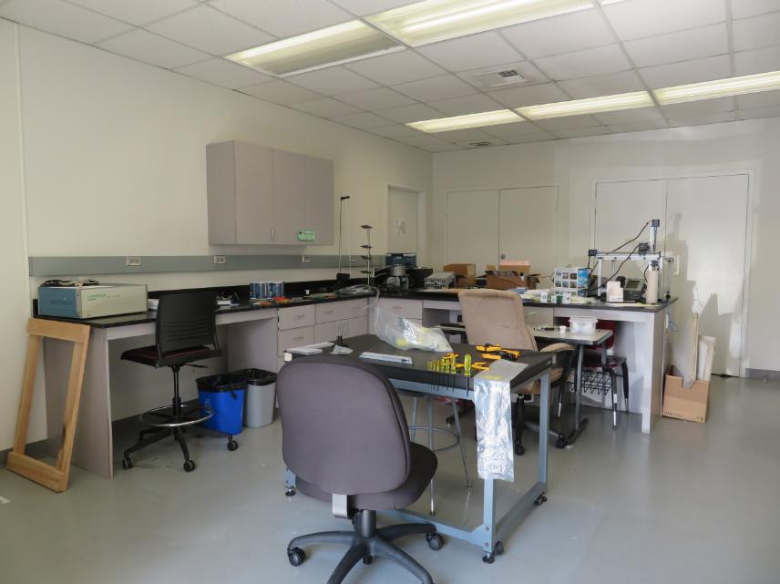 An empty science lab with a chair in the center